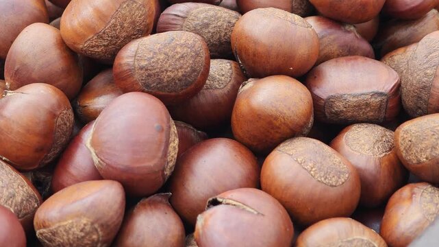 Roasted chestnuts in a pan.