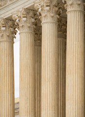 Naklejka premium Columns stone repetition symmetry perspective. Columns marble architectural pattern. Columns decorative capitals carved detail. Columns neoclassical heritage exterior.
