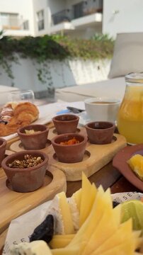 Royal Arabian all-inclusive breakfast with smoked salmon, cheese platter, basturma, fresh fruits and pastries. Elegant morning dining at a luxury resort terrace during a sunny summer vacation.