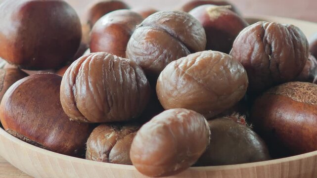 Roasted chestnuts in a container.