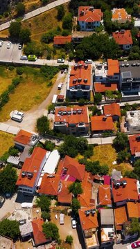 Vertical video. Fethiye, Turkey. Historic site of Telmessos featuring the monumental Tomb of Amyntas and ancient Lycian rock tombs carved into cliffs, aerial drone view.. Aerial View, MasterShots, Fl