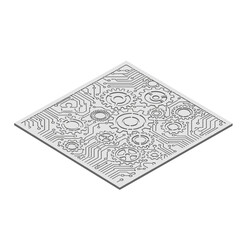 Intricate stencil sheet with gear and circuit patterns isolated on a white background, showcasing mechanical and technological design elements
