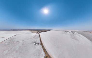 Aksaray, Turkey. Expansive aerial panorama of white Tuz Golu salt flats crossed by dark dirt roads,...