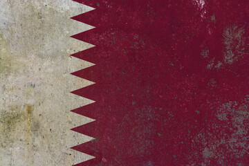 Qatar national flag painted on textured wall mural background © Cristian Valderas