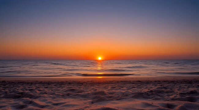 Vibrant sunset over calm ocean waves, with warm orange and purple sky and sandy beach