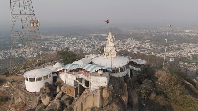 Bamleshwari Temple Dongargarh aerial drone view, Maa Bamleshwari Mandir hilltop temple Chhattisgarh, Hindu temple with red flag Bamleshwari Dongargarh, Sacred Bamleshwari temple tower drone shot India