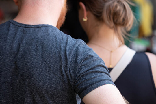 Man shoulder, male shoulder, daily commute, routine city travel, unposed movement, natural candid motion, close up, at Chatuchak Market.