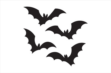 Fototapeta premium Four black silhouettes of bats in flight against a plain white background