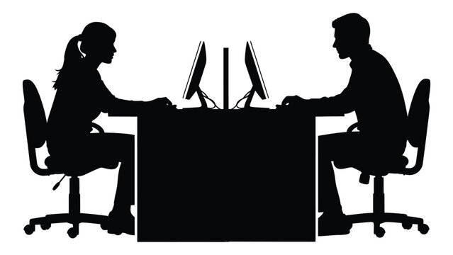 A man and woman sitting at a desk with computers