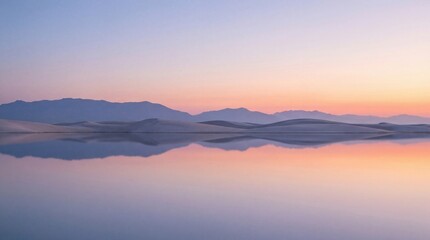 Obraz premium Panoramic sunrise over a mirror-like lake in the desert, minimalist desert reflection high-definition commercial background material.