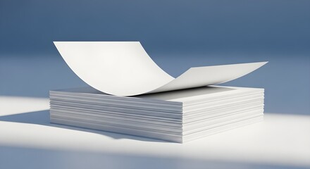 Stack of white business cards, one fanned out on top, on a clean surface with blue background, professional