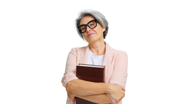 Confident mature woman holding book smiling