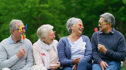 Props, sunglasses and old people outdoor with laugh, funny joke or bonding together for retirement....