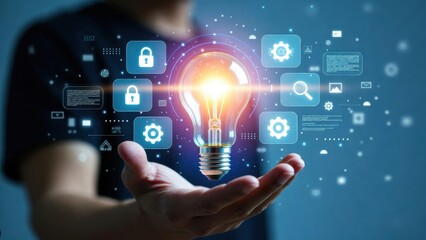 Fototapeta premium Innovative technology concepts illuminated by a glowing light bulb in a hand.