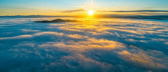 Fototapeta premium Aerial view of the sun rising over mountain peaks emerging from a vast sea of clouds.