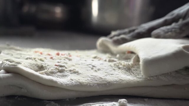 Traditional cooking process and texture of fresh dough used in Indian flatbread making. Naan Preparing.