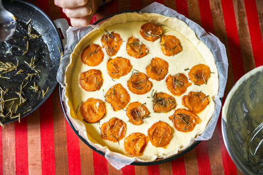 Recipe of apricot pie on a wooden table