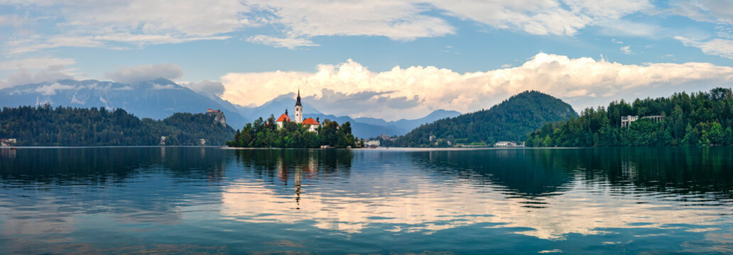 Lake Bled in late afternoon light with Bled Island in the middle which the lake surrounds with the church, Assumption of Mary, Built 17th century, Lake Bled, Slovenia, Central Europe