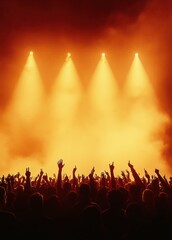 Fototapeta premium Silhouetted concert crowd with raised hands under warm golden spotlights and stage fog, energetic celebratory atmosphere
