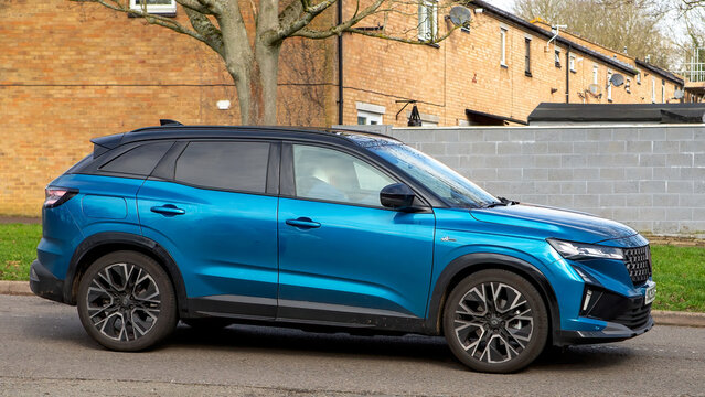 Milton Keynes,Bucks,UK - Mar 3rd 2026: 2025 blue Renault Austral icnc esprit Alpine hybrid electric SUV car driving on a British road