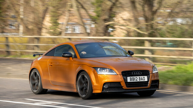 Milton Keynes,Bucks,UK - Mar 5th 2026: 2014 orange Audi tt diesel engine car driving on a British road