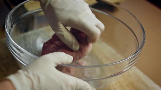Close up of the process of kneading beetroot dough for pizza