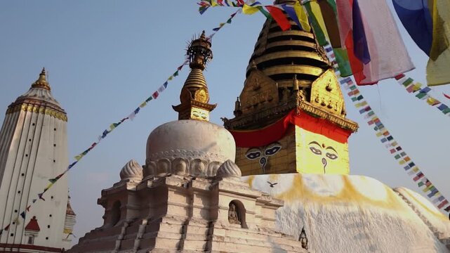 Ancient Buddhist Stupa with Golden Spire and Colorful Prayer Flags
