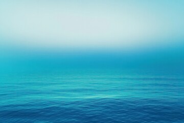 Obraz premium calm blue sea with gentle ripples under a soft gradient sky, tranquil and endless horizon