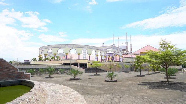 Semarang, Indonesia, October 3, 2022 : The expansive courtyard and rows of pillars blending Roman, Javanese, and Arabic styles at the Great Mosque of Central Java in Semarang. 