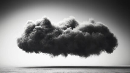 low, dark cloud hovering above a flat barren landscape with a moody, foreboding atmosphere