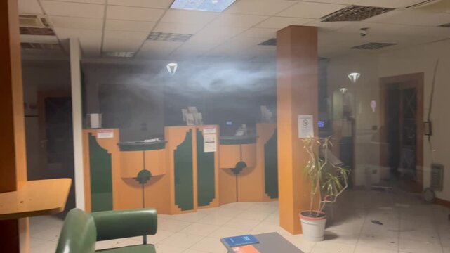 Pineto, Italy &ndash; March 21, 2026: Firefighters and police respond after an explosion during a bank robbery. Debris, damage and emergency vehicles are visible at the scene.