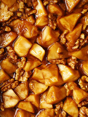 Caramelized Apple Chunks and Toasted Walnuts in Rich Caramel Sauce, Extreme Macro Overhead Food Photography