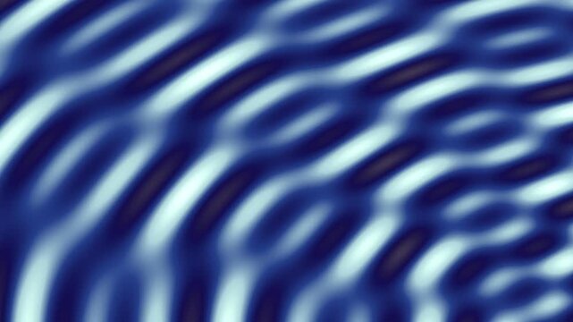 An abstract, blue-toned image displaying concentric and blurred, wavy patterns and rings