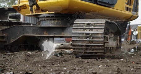 Fototapeta premium Operator engaging controls, moving excavator, exposing worn track assembly for construction service