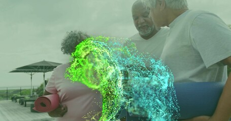 Holding mats, three adults in casual wear chatting on wooden deck, parasol and blue-green effect