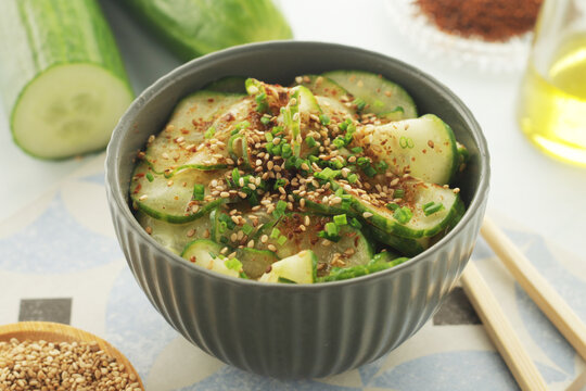 A bowl with Korean cucumber salad Oi Muchim