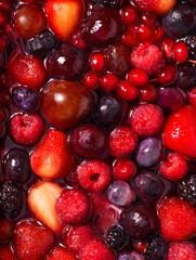 Obraz premium Mixed Berries Densely Packed in Glossy Syrup, Extreme Macro Overhead Food Photography