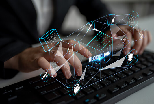 Business Professional Engaging with Blockchain Technology and Digital Icons on a Modern Keyboard in a High-Tech Environment Quark.