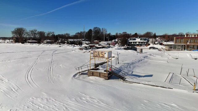 Aerial Drone View of Gas Refueling Sign for Boats at Port in Gosport Brighton Ontario on a Winter Day in Canada