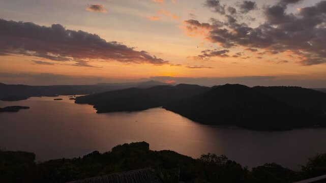 Sunset timelapse overlooking Ta Dung Lake from a hilltop in Dak Nong, Central Highlands Vietnam