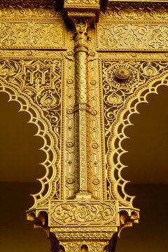 . Intricate gold architectural detail with ornate decorative patterns
