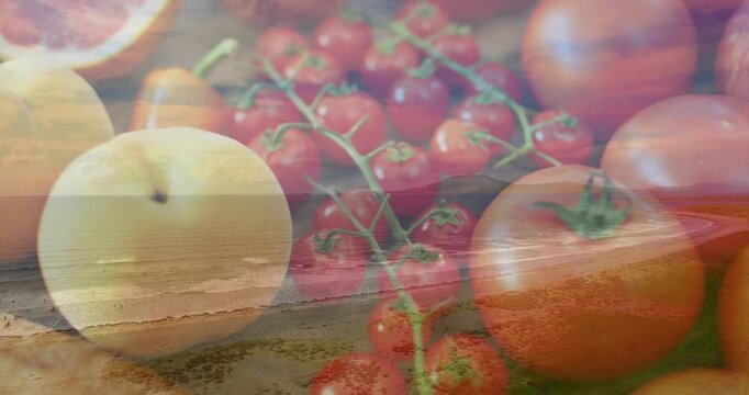 Cherry tomatoes holding center on board, crossfade starting waves sweeping over fruits for food art