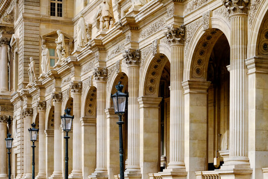 Elegant Paris arcade with stone arches and vintage street lamps