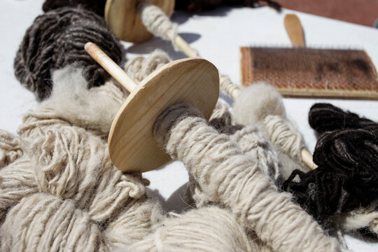 Window Rock, Arizona, USA. Navajo Nation, hand spinning wool with spindle traditional fiber craft close up