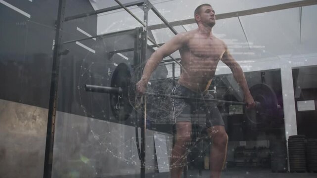 Male athlete using leg drive, snatching bar overhead in gym rig for fitness, speckled overlay