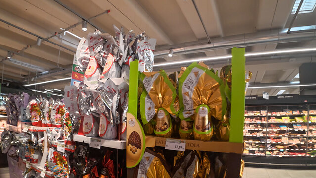 Despar supermarket aisle displaying Ferrero Rocher Easter eggs and other chocolates