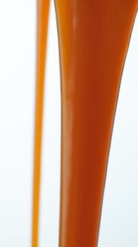 Pouring Caramel Sauce Stream, Macro Slow Motion Texture
