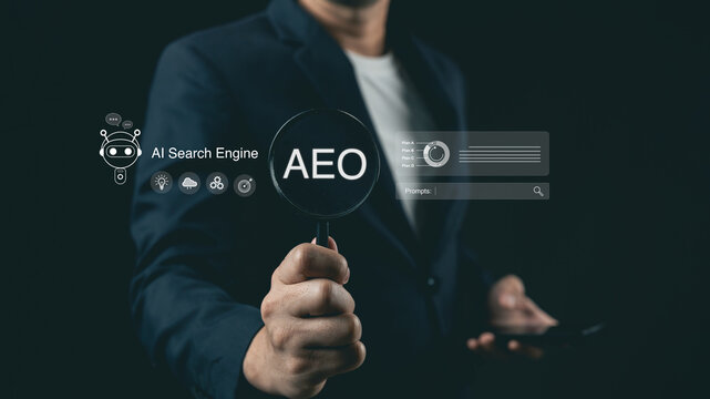 Businessman holding magnifying glass with AEO text and AI search engine futuristic digital overlay for digital marketing strategy on dark background