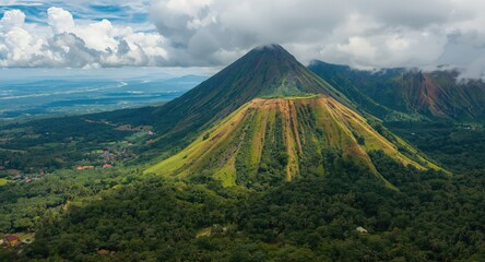 Fototapeta premium Dynamic oil art capturing the vivid essence of a tropical volcano environment teeming with greenery