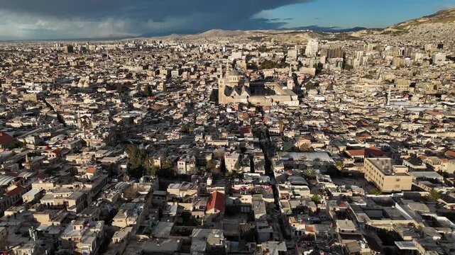 aerial drone panorama of the Umayyad Mosque in Damascus, Syria, highlighting the massive courtyard and the ancient Old City district